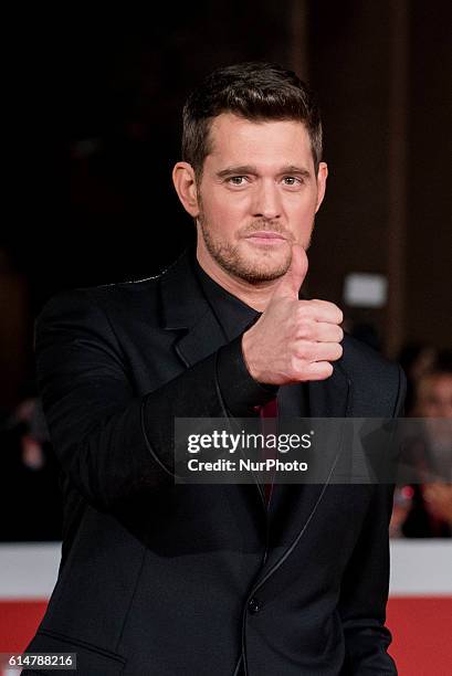 Michael Buble poses with Thumbs Up during a red carpet for 'Tour Stop 148' during the 11th Rome Film Festival at Auditorium Parco Della Musica on...