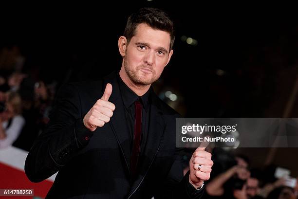 Michael Buble poses with Thumbs Up during a red carpet for 'Tour Stop 148' during the 11th Rome Film Festival at Auditorium Parco Della Musica on...