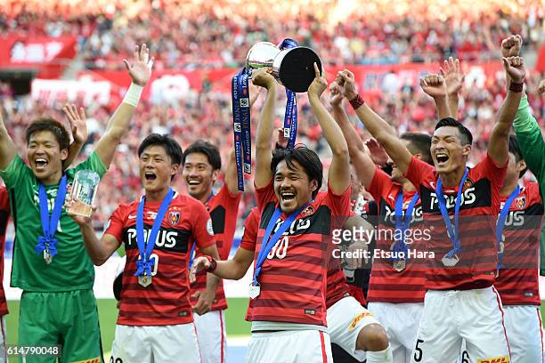 Players of Urawa Red Diamonds celebrate with the trophy after the J.League Levain Cup Final match between Gamba Osaka and Urawa Red Diamonds at the...