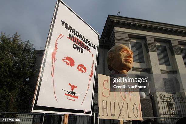 People rally in front of the Russian Embassy building as they take part in an international protest &quot;Stop Putin's War in Ukraine&quot;