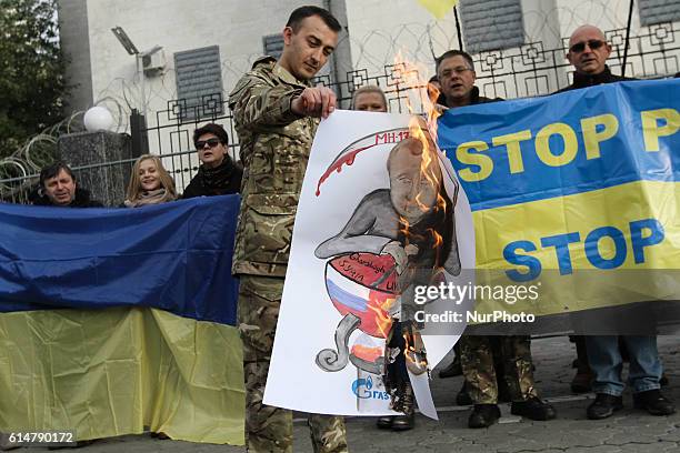 People rally in front of the Russian Embassy building as they take part in an international protest &quot;Stop Putin's War in Ukraine&quot;