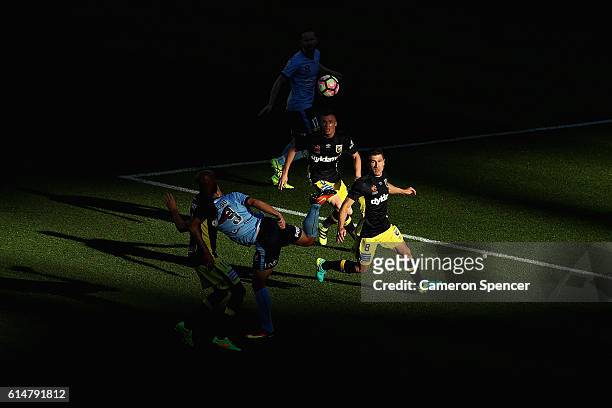Bobo of Sydney FC kicks the ball ahead of Nick Montgomery of the Mariners during the round two A-League match between Sydney FC and the Central Coast...