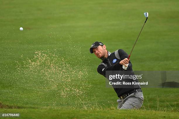 Chris Wood of England plays his third shot fom a bunker on the second hole during the third round of the British Masters at The Grove on October 15,...