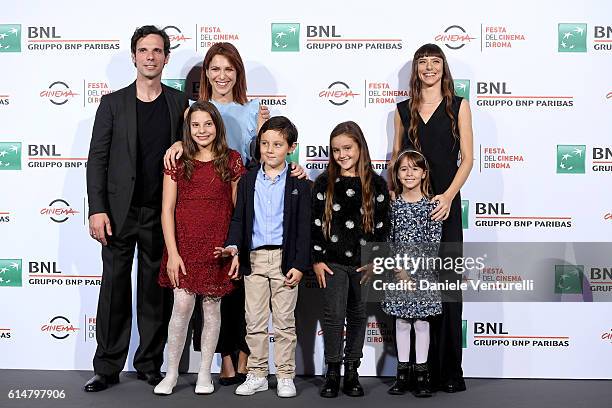 Cast members of the movie attend a photocall for 'Sole Cuore Amore' during the 11th Rome Film Festival at Auditorium Parco Della Musica on October...