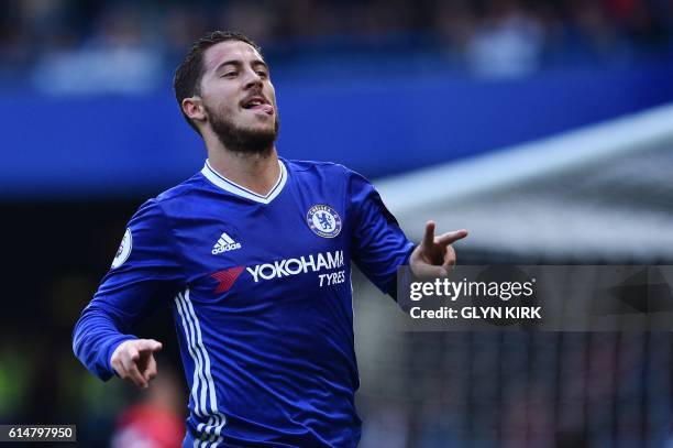 Chelsea's Belgian midfielder Eden Hazard celebrates with a gesture in support of Willian, who's mother passed away recently, after scoring Chelsea's...