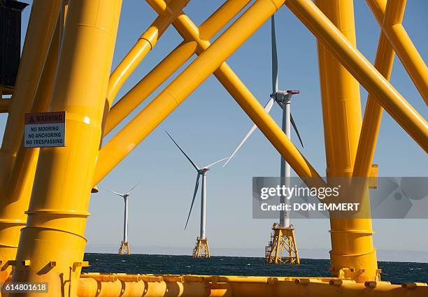 Wind turbines, of the Block Island Wind Farm, tower over the water on October 14, 2016 off the shores of Block Island, Rhode Island. The first...