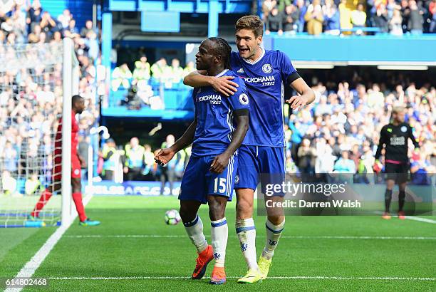 Victor Moses of Chelsea celebrates scoring his sides third goal with team mate Marcos Alonso of Chelsea during the Premier League match between...