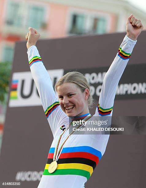 Denmark's gold medallist Amalie Dideriksen celebrates on the podium at the end of the women's elite road race event as part of the 2016 UCI Road...