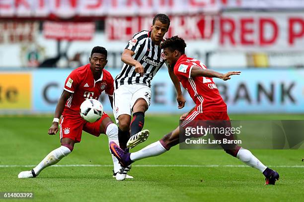 Timothy Chandler of Frankfurt and David Alaba and Kingsley Coman of Bayern Muenchen battle for the ball during the Bundesliga match between Eintracht...