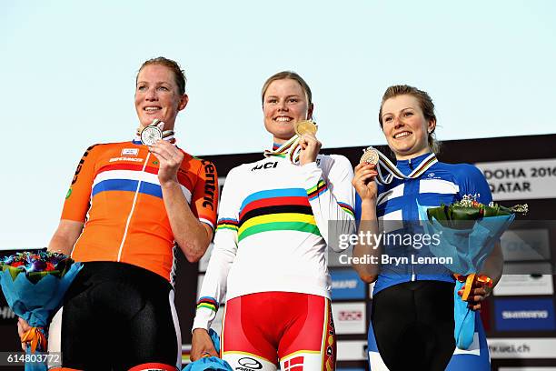 Gold medalist Amalie Dideriksen of Denmark celebrates on the podium with second placed Kirsten Wild of Netherlands and third placed Lotta Lepisto of...