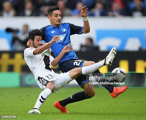 Onur Bulut of Freiburg and Benjamin Huebner of Hoffenheim compete for the ball during the Bundesliga match between TSG 1899 Hoffenheim and SC...