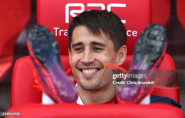 Bojan Krkic of Stoke City smiles while taking his seat on the bench during the Premier League match between Stoke City and Sunderland at Bet365...