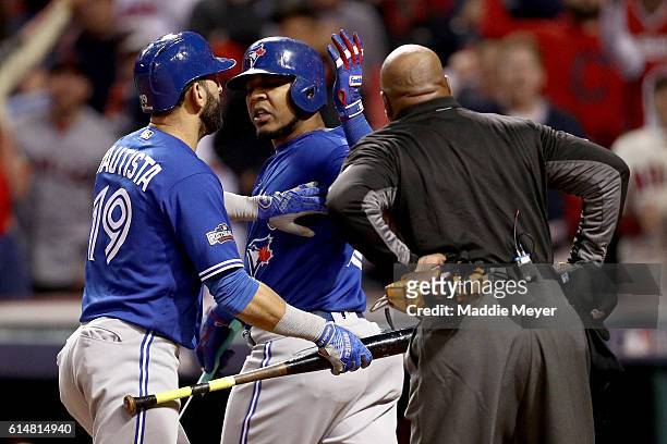 Edwin Encarnacion of the Toronto Blue Jays argues a strike out called by Home Plate umpire Laz Diaz in the eighth inning against the Cleveland...