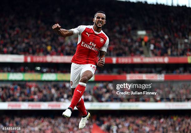 Theo Walcott of Arsenal celebrates scoring his sides second goal during the Premier League match between Arsenal and Swansea City at Emirates Stadium...