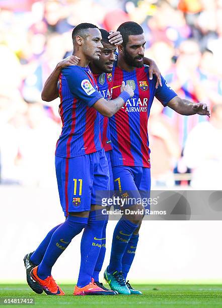 Rafinha Alcantara of FC Barcelona celebrates with his team mates Neymar Jr. And Ardan Turan after scoring his team's first goalduring the La Liga...