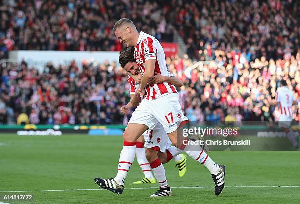 Joe Allen of Stoke City celebrates scoring his sides second goal with his team mate Ryan Shawcross of Stoke City during the Premier League match...