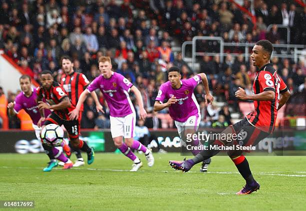 Junior Stanislas of AFC Bournemouth scores his sides third goal from the penalty spot during the Premier League match between AFC Bournemouth and...