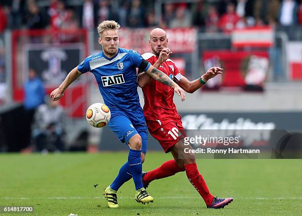 Nils Butzen of Magdeburg and Daniel Brueckner of Erfurt compete during the Third League match between FC Rot Weiss Erfurt and 1. FC Magdeburg at...