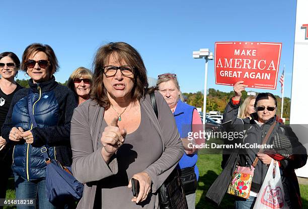 Donald Trump supporter shouts across the street at protestors outside a rally at Toyota Of Portsmouth on October 15, 2016 in Portsmouth, New...
