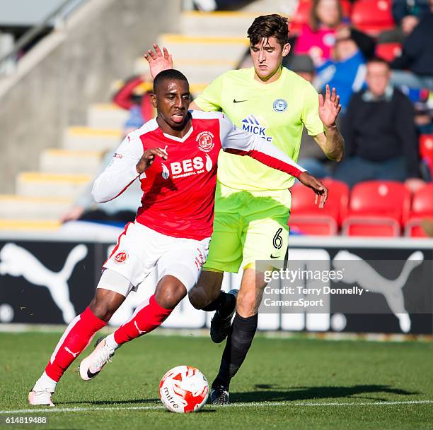 Fleetwood Town's Amari'i Bell vies for possession with Peterborough United's Jack Baldwin during the Sky Bet League One match between Fleetwood Town...