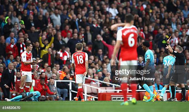 Granit Xhaka of Arsenal reacts to being shown a red card by referee Jonanthan Moss during the Premier League match between Arsenal and Swansea City...