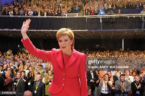 Nicola Sturgeon, First Minister of Scotland and leader of the Scottish National Party waves after delivering her keynote address to delegates at the...