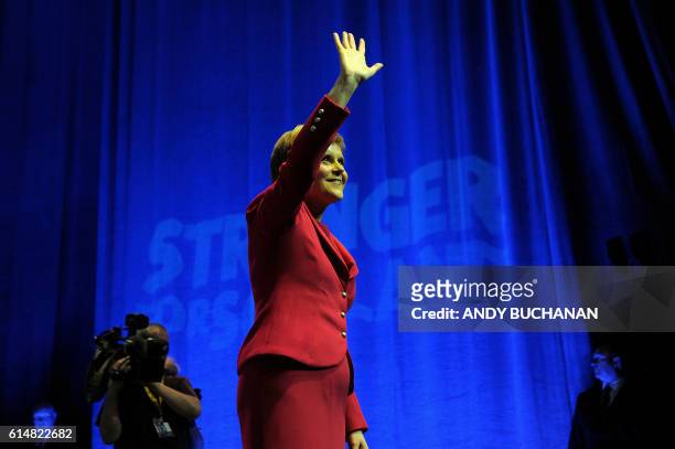 Nicola Sturgeon, First Minister of Scotland and leader of the Scottish National Party waves after delivering her keynote address to delegates at the...