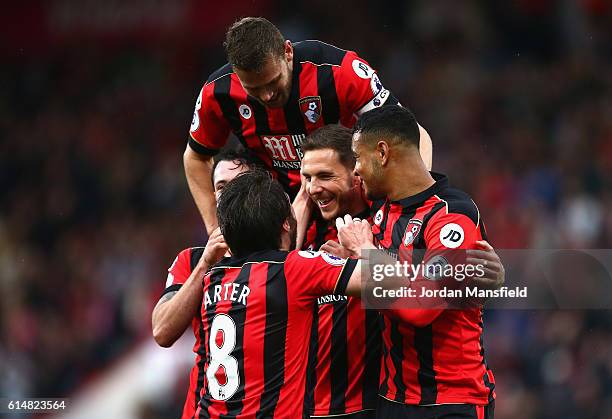 Dan Gosling of AFC Bournemouth celebrates scoring his sides sixth goal during the Premier League match between AFC Bournemouth and Hull City at...