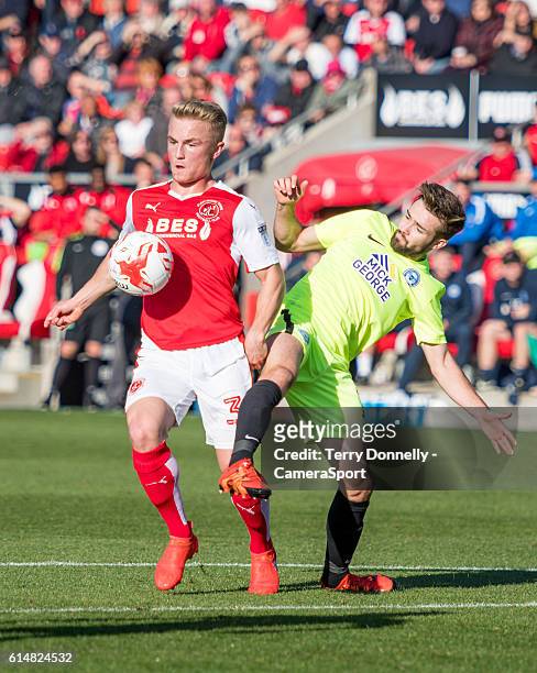 Fleetwood Town's Kyle Dempsey vies for possession with Peterborough United's Gwion Edwards during the Sky Bet League One match between Fleetwood Town...