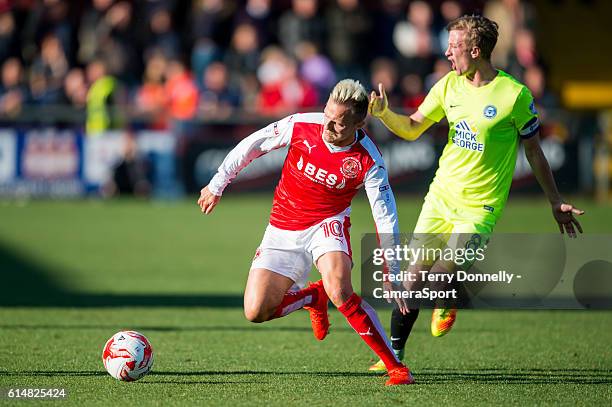 Fleetwood Town's David Ball vies for possession with Peterborough United's Chris Forrester during the Sky Bet League One match between Fleetwood Town...