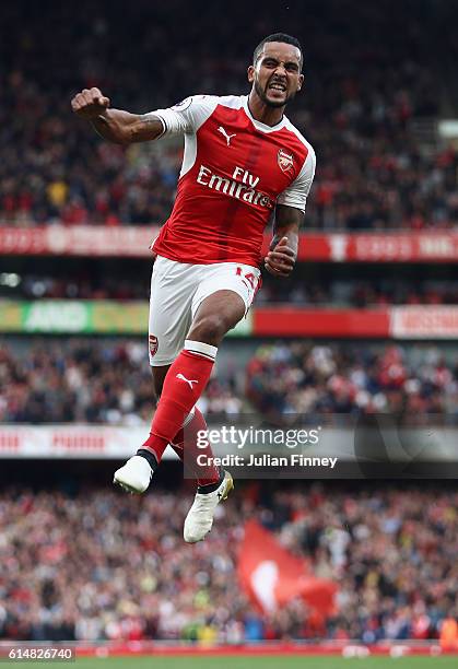 Theo Walcott of Arsenal celebrates scoring his second goal during the Premier League match between Arsenal and Swansea City at Emirates Stadium on...