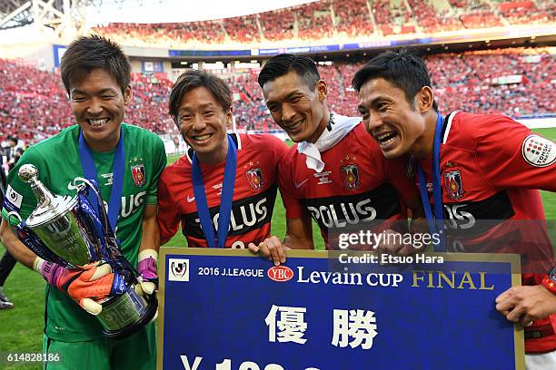 Players of Urawa Red Diamonds celebrate with the trophy after the J.League Levain Cup Final match between Gamba Osaka and Urawa Red Diamonds at the...