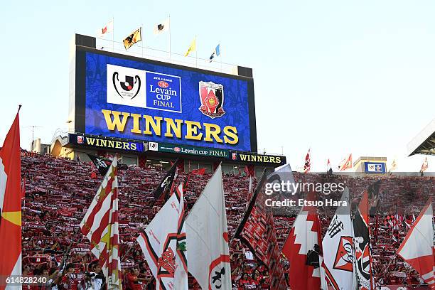 Fans of Urawa Red Diamonds celebrate their victory after the J.League Levain Cup Final match between Gamba Osaka and Urawa Red Diamonds at the...