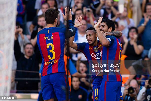 The FC Barcelona player Luis Suarez from Uruguay celebrating the third goal of the match with Gerard Pique from Spain and Neymar from Brasil during...