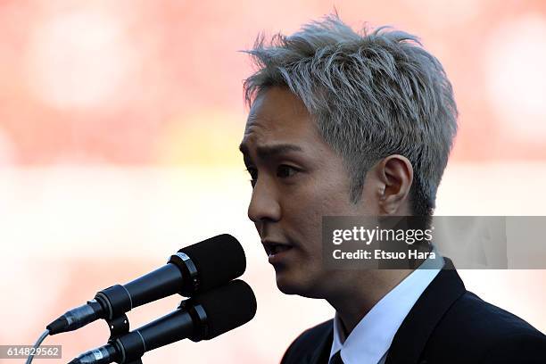 Singer Naoya Urata of AAA sings national anthem of Japan prior to the J.League Levain Cup Final match between Gamba Osaka and Urawa Red Diamonds at...