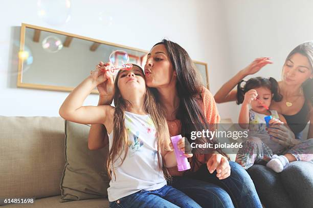 mothers and daughters having fun together at home - bubble ponytail stock pictures, royalty-free photos & images