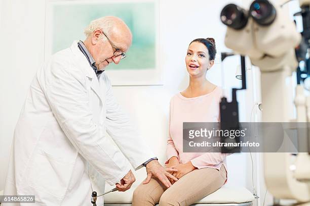 doctor neurologist testing patellatendon`s reflex  use medical tendon hammer - doctor's surgery stock pictures, royalty-free photos & images