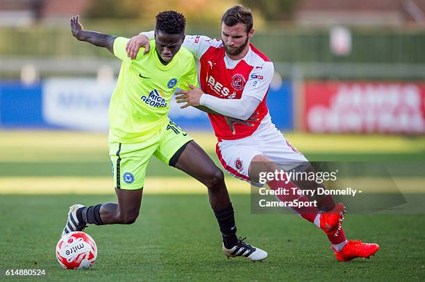 Fleetwood Town's Jimmy Ryan vies for possession with Peterborough United's Leo Da-Silva-Lopes during the Sky Bet League One match between Fleetwood...