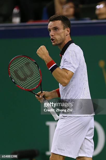 Roberto Bautista Agut of Spain celebrates a point against Novak Djokovic of Serbia during the Men's singles semifinal match on day 7 of Shanghai...
