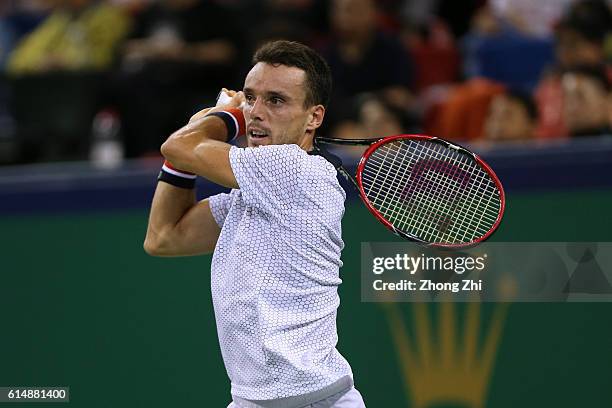 Roberto Bautista Agut of Spain returns a shot against Novak Djokovic of Serbia during the Men's singles semifinal match on day 7 of Shanghai Rolex...