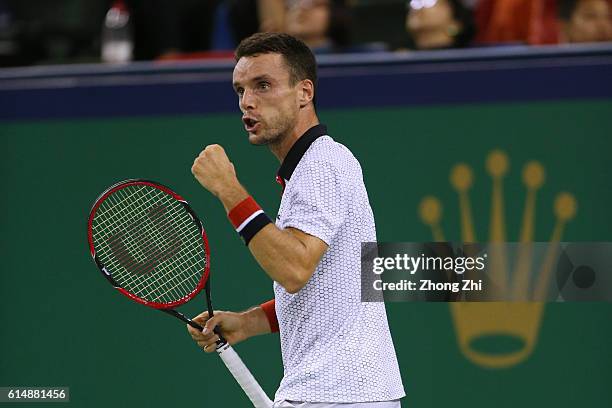 Roberto Bautista Agut of Spain celebrates a point against Novak Djokovic of Serbia during the Men's singles semifinal match on day 7 of Shanghai...