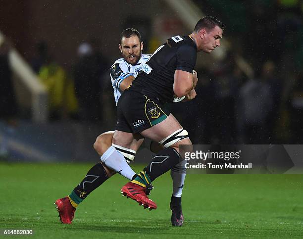 Louis Picamoles of Northampton Saints is tackled by Nic White of Montpellier during the European Rugby Champions Cup match between Northampton Saints...