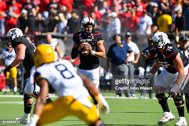 Patrick Mahomes II of the Texas Tech Red Raiders looks to pass during the first half of the game against the West Virginia Mountaineers on October...
