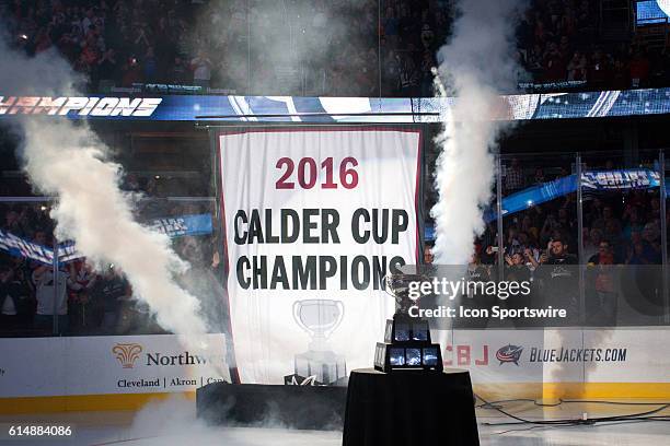 With the Calder Cup on display, the Cleveland Monsters raise their 2016 Calder Cup Championship banner prior to the game against the Rockford IceHogs...