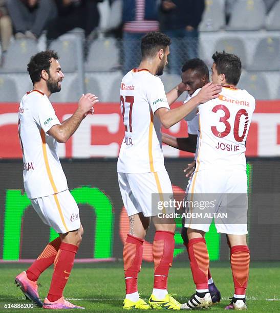 Bruma of Galatasaray is congratulated by teammates after scoring a goal during the Turkish Super Lig football match between Genclerbirligi and...