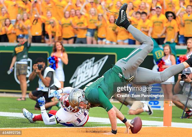Seth Russell of the Baylor Bears scores a touchdown against Mike Lee of the Kansas Jayhawks in the first quarter on October 15, 2016 in Waco, Texas.
