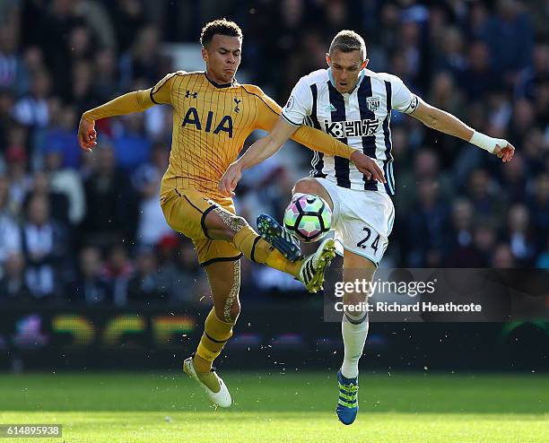 Dele Alli of Tottenham Hotspur and Darren Fletcher of West Bromwich Albion battle for possession during the Premier League match between West...