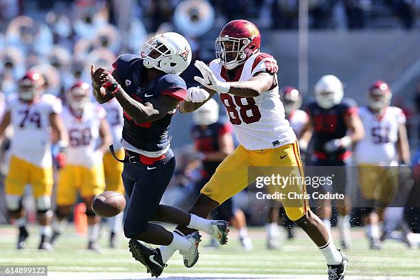 Tight end Daniel Imatorbhebhe of the USC Trojans pushes safety Jarvis McCall Jr. #29 of the Arizona Wildcats during the second quarter of the college...