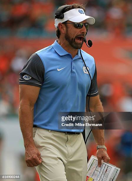 North Carolina Tar Heels head coach Larry Fedora calls a play during a game against the Miami Hurricanes at Hard Rock Stadium on October 15, 2016 in...