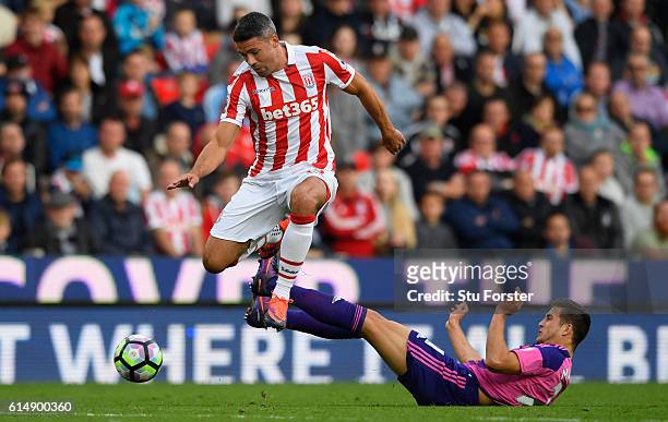 Stoke player Jonathan Walters skips the challenge of Javier Manquillo of Sunderland during the Premier League match between Stoke City and Sunderland...